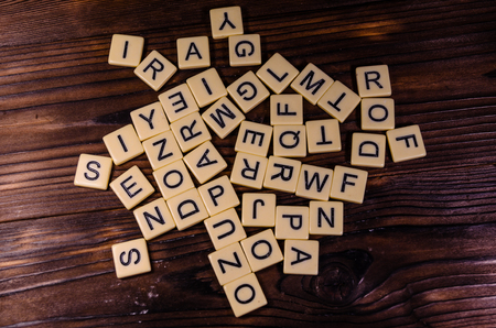 Different random letters on rustic wooden tableの写真素材