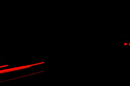 Trails of the car lights on night road