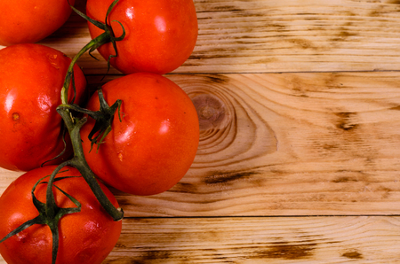 Fresh ripe tomatoes on rustic wooden table. Top viewの写真素材
