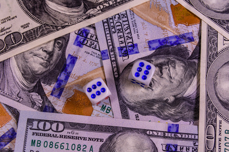 Dice on one hundred dollar bills. Gamble conceptの写真素材