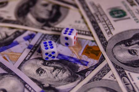 Dice on one hundred dollar bills. Gamble conceptの写真素材