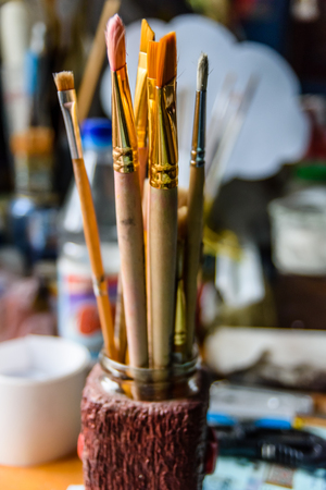 Different paint brushes in modern art studioの写真素材