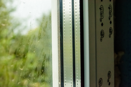 Detail photo of modern window made of PVC profilesの写真素材