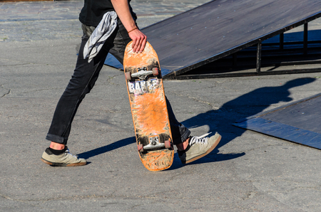 Skater with his skateboard in a skateparkの写真素材