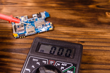 Inspecting of the electronic circuit board with the multimeterの写真素材
