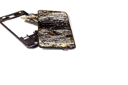 Broken modern smartphone isolated on white backgroundの写真素材