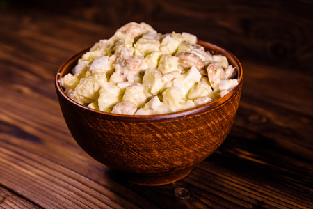 Salad with haricot beans and meat dressed with mayonnaise in ceramic bowlの写真素材
