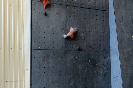 Hand hooks on empty artificial climbing wallの写真素材
