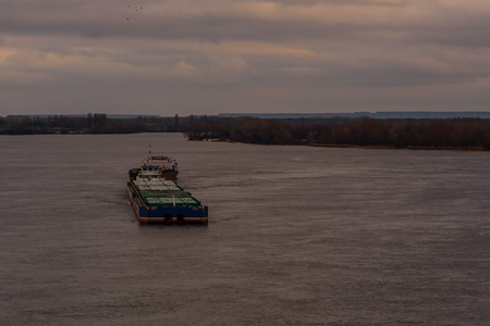 Big barge and ship on a river Dnieperの写真素材