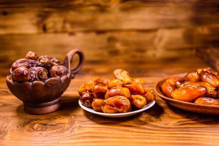 Date fruits on a rustic wooden tableの写真素材