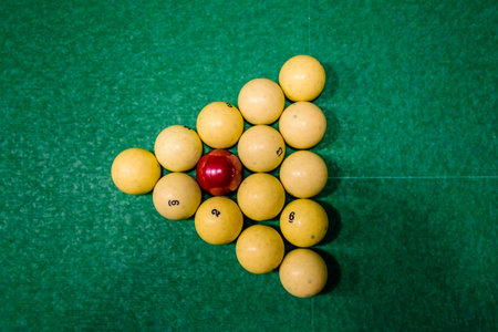 Triangle of balls on a green cloth. Russian billiard. Top view