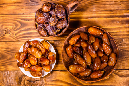 Date fruits on rustic wooden table. Top viewの写真素材