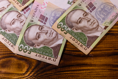 Ukrainian five hundred hryvnas banknotes on rustic wooden tableの写真素材