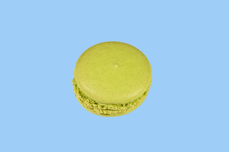 French macaroon isolated on a blue backgroundの写真素材