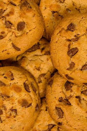 Pile of fresh chocolate chip cookies for background