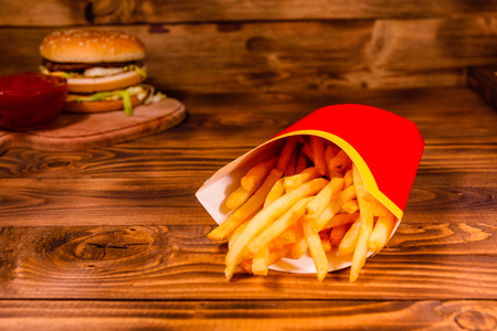 French fries and hamburger on rustic wooden tableの写真素材