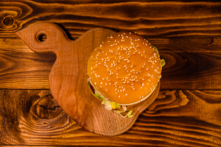 Fresh hamburger on a rustic wooden table. Top viewの写真素材