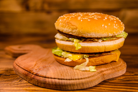 Fresh hamburger on a rustic wooden tableの写真素材