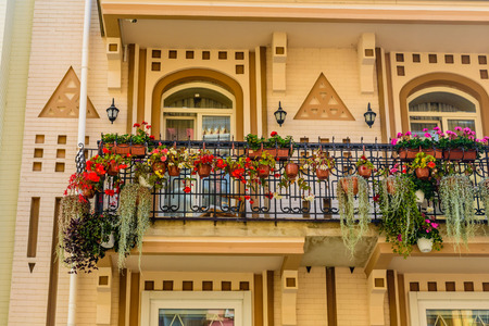 Flowers on a balcony of residential buildingの写真素材