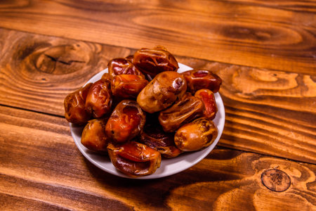Date fruits on a rustic wooden table