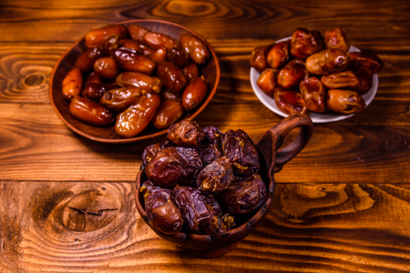 Date fruits on a rustic wooden tableの写真素材