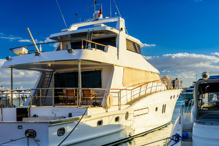 White luxury yacht in sea harbor of Hurghada, Egypt. Marina with tourist boats on Red Sea