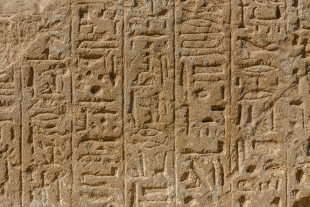 Egyptian ancient hieroglyphs on a stone wall