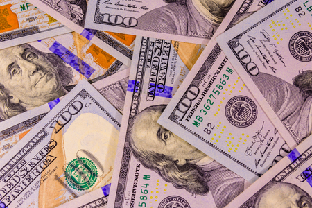Background of many american one hundred dollar banknotesの写真素材