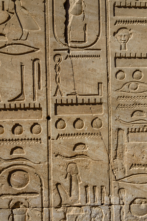 Egyptian ancient hieroglyphs on a stone wallの写真素材