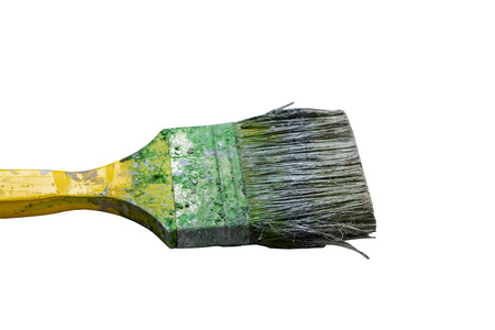 Dirty green paintbrush isolated on white backgroundの写真素材