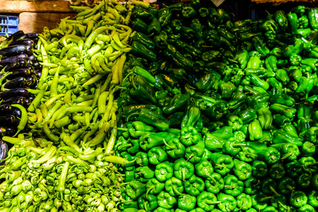 Fresh ripe green peppers for sale on fruit marketの写真素材