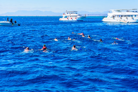 Hurghada, Egypt - December 7, 2018: Group of tourists snorkeling in Red sea. Summer vacation conceptのeditorial素材