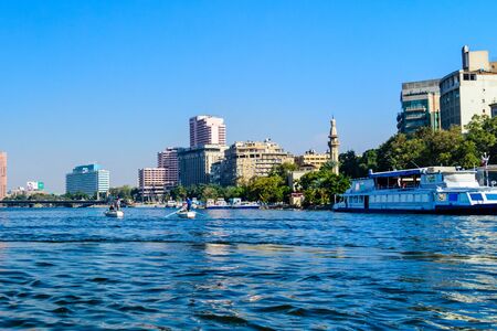 Cairo, Egypt - December 8, 2018: Poor egyptian fishermen in boat on Nile riverのeditorial素材