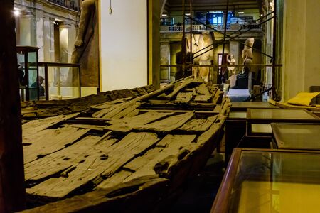 Cairo, Egypt - December 8, 2018: ancient wooden boat in Museum of Egyptian Antiquities (known commonly as the Egyptian Museum or Museum of Cairo)のeditorial素材