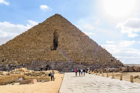 Cairo, Egypt - December 8, 2018: Tourists near great pyramid of Cheops in Giza plateau. Cairo, Egyptのeditorial素材