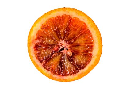 Slice of sicilian orange isolated on white backgroundの写真素材