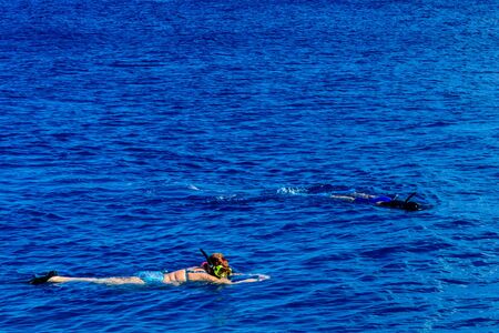 Young woman snorkeling in Red sea. Summer vacation conceptの写真素材