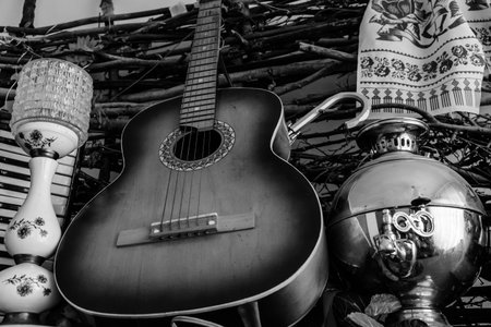 Six string classical acoustic guitar and old russian samovar