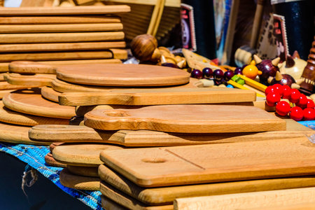 Different wooden utensil for sale on street fair