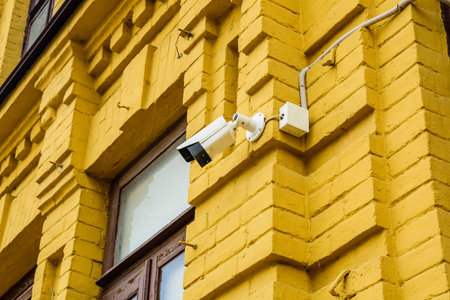 Security camera on facade of the residential building