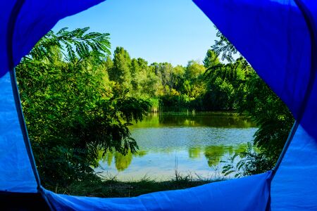 View on river from tent in morningの写真素材