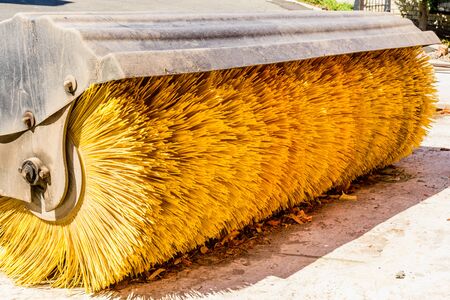 Yellow brush of the road cleaning machineの写真素材