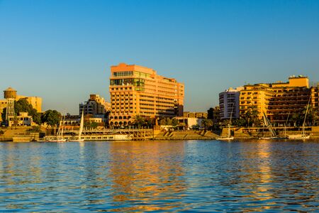Residential buildings on a bank of Nile river in Luxor, Egyptの写真素材