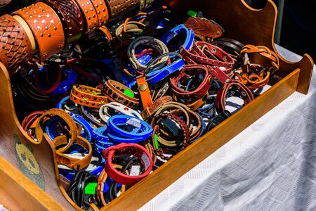 Different leather wristbands for sale on street fairの写真素材