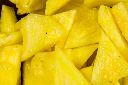 Pieces of the chopped pineapple for backgroundの写真素材