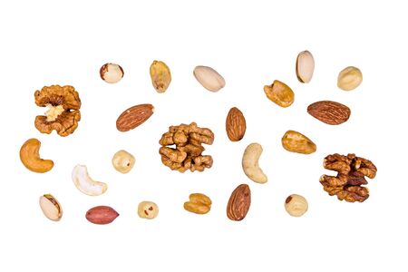Various nuts (almond, cashew, hazelnut, pistachio, walnut) isolated on white background. Vegetarian meal. Healthy eating conceptの写真素材