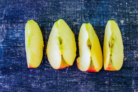 Sliced ripe apple on rustic wooden table. Top viewの写真素材