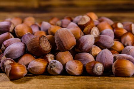 Pile of the hazelnuts on rustic wooden tableの写真素材
