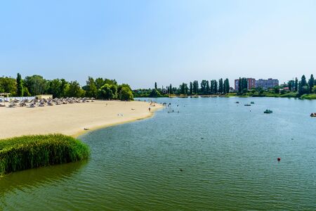 Myrhorod, Ukraine - August 26, 2018: People at sand beach on river Khorol in Myrhorod, Ukraineのeditorial素材