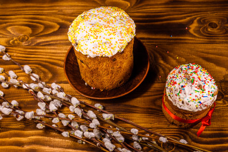 Ukrainian easter bread kulich and pussywillow branches on rustic wooden table